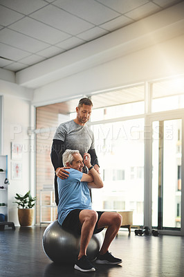 Buy stock photo Physio, therapy and old man stretching on ball in mobility training, support or muscle workout. Fitness, physiotherapy and elderly person with exercise, development or senior healthcare in retirement