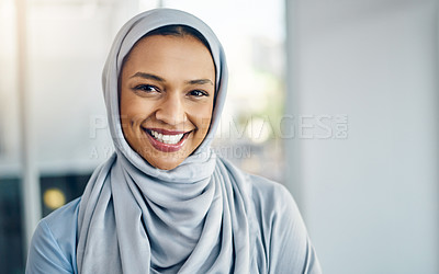Buy stock photo Portrait of a cheerful young businesswoman standing inside the office with her arms folded at work during the day