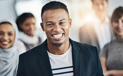 Buy stock photo Portrait of a cheerful young businessman standing in the office at work during the day