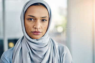 Buy stock photo Portrait of a confident young businesswoman standing inside the office at work