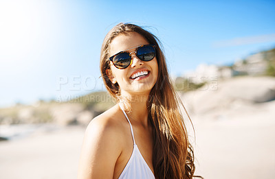 Buy stock photo Portrait, beach and woman with sunglasses, excited and smile with happiness, holiday and weekend break. Face, person and girl with eyewear, seaside and vacation with getaway trip, travel and sunshine