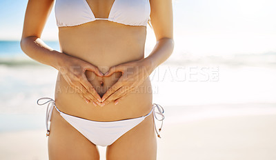 Buy stock photo Cropped shot of an unrecognizable woman posing in her bikini on the beach