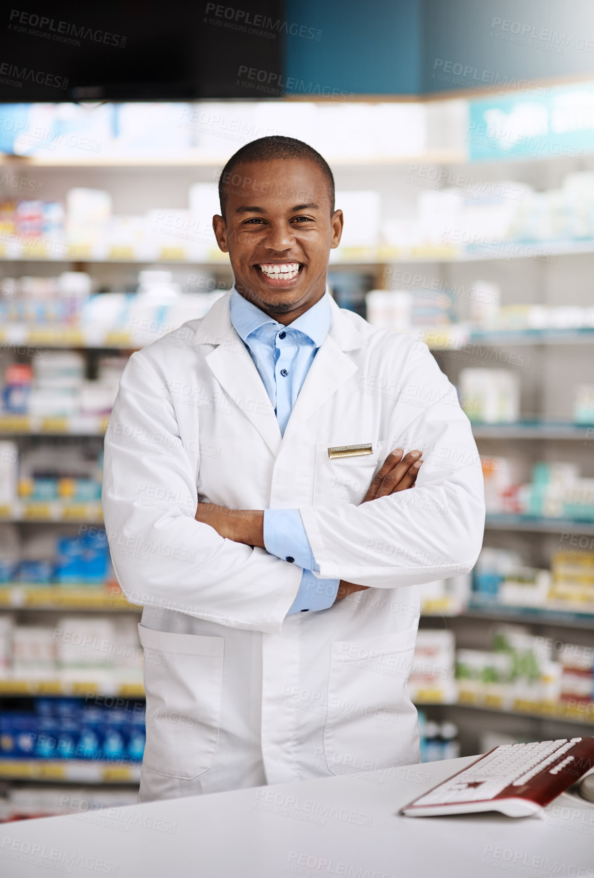 Buy stock photo Portrait of a young pharmacist working in a chemist