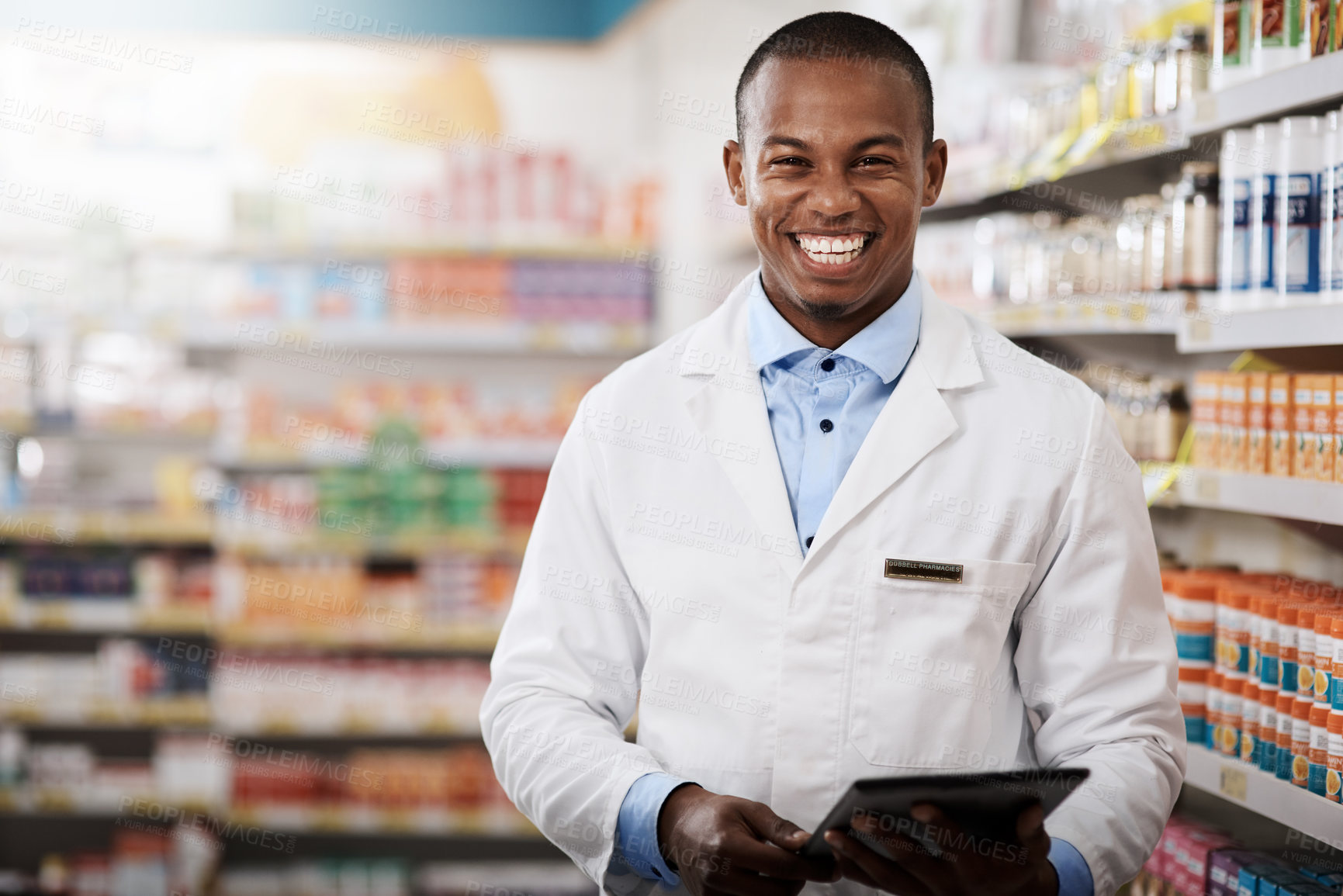 Buy stock photo Portrait of a young pharmacist working in a chemist