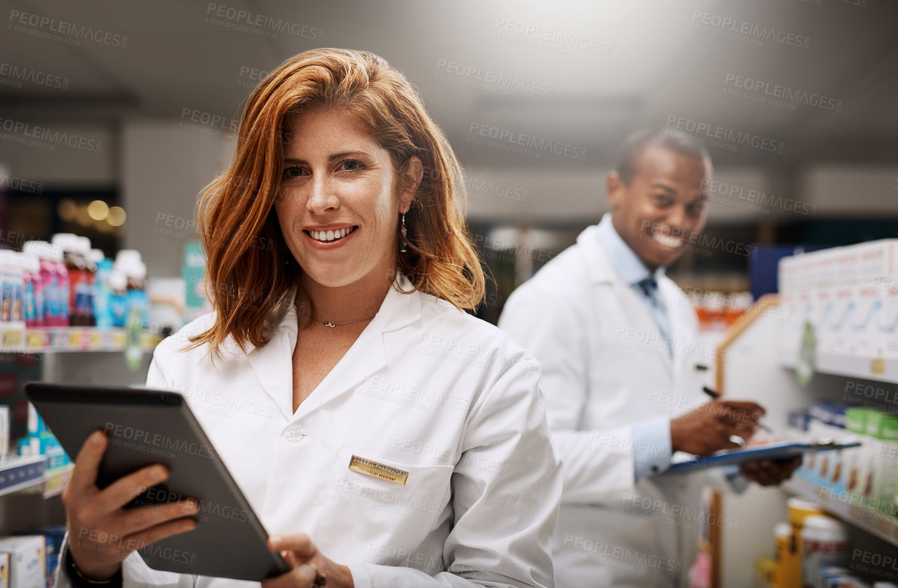 Buy stock photo Portrait of two pharmacists working together in a chemist