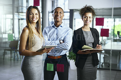 Buy stock photo Portrait of a group of young businesspeople working together in a modern office