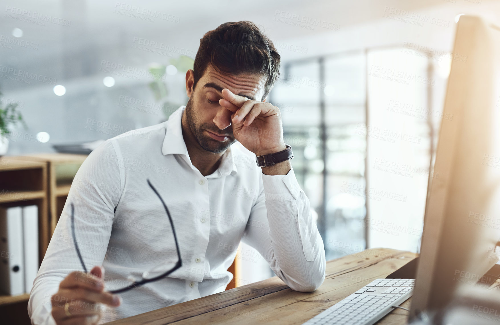 Buy stock photo Sad, tired and a man at work with burnout, career problem or anxiety from deadline. Corporate, working and a businessman with fatigue, mental health issue and stress from mistake in professional job
