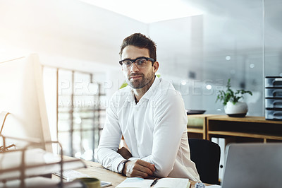 Buy stock photo Portrait of a young businessman working in an office