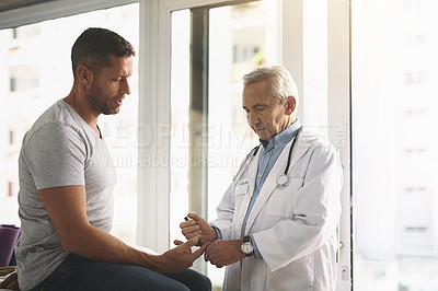 Buy stock photo Consultation, doctor and man with diabetes test, advice and wellness at clinic for health insurance. Discussion, patient and medical professional checking glucose, insulin or assessment for results