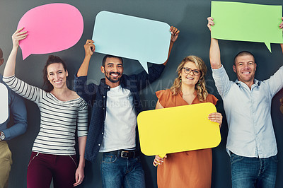 Buy stock photo Studio shot of a diverse group of people holding up speech bubbles against a gray background