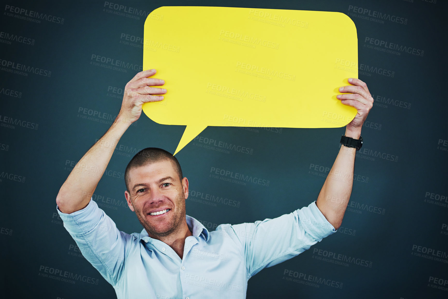 Buy stock photo Man, portrait and speech bubble in studio for advertising, social media and information with smile. Male person, icon and poster with mockup space for review, opinion and billboard on gray background