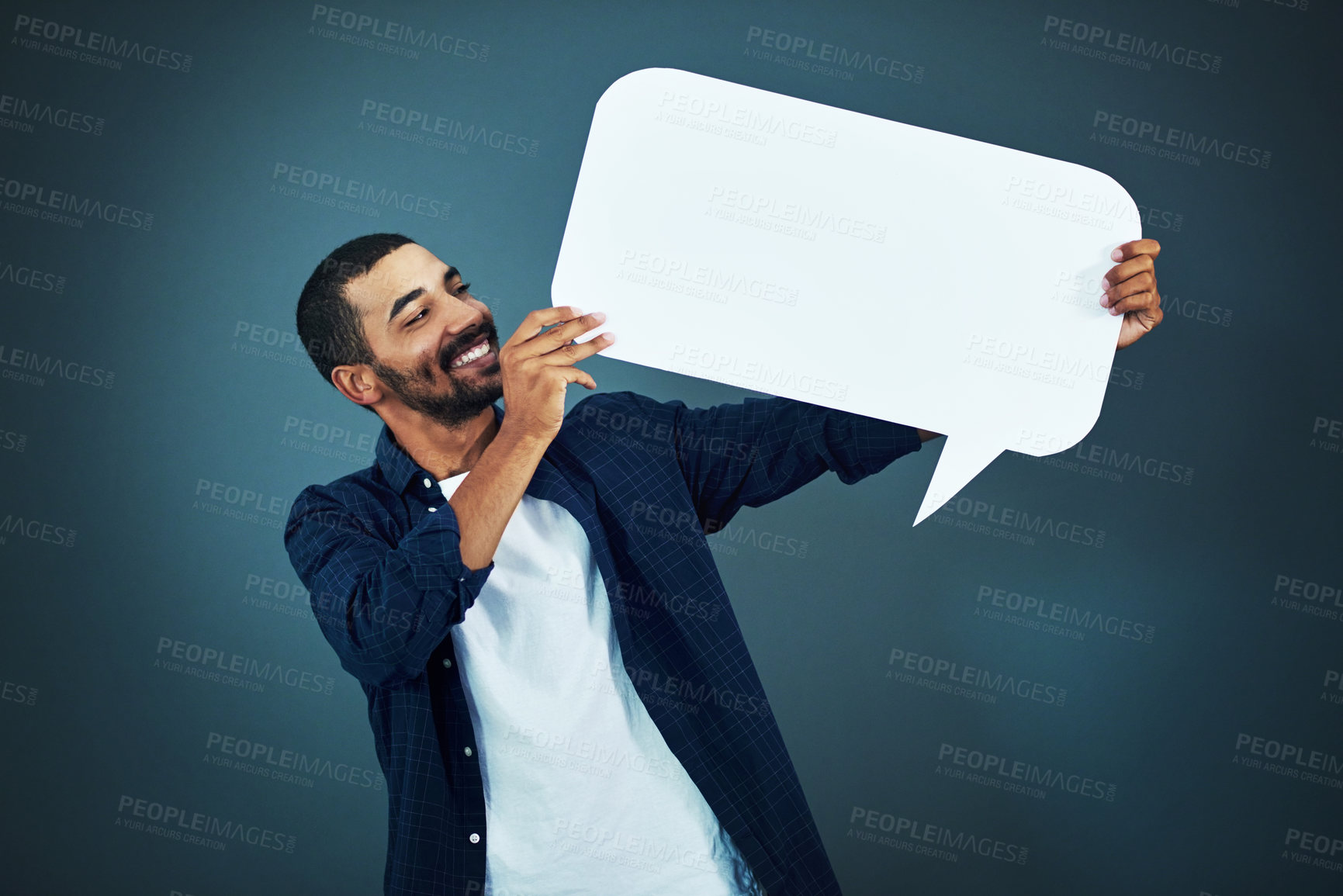 Buy stock photo Man, happy and speech bubble in studio for advertising, marketing. and social media with information. Male person, icon and poster with mockup for review, opinion and billboard on gray background