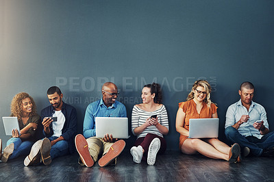 Buy stock photo Studio shot of a diverse group of people social networking against a gray background