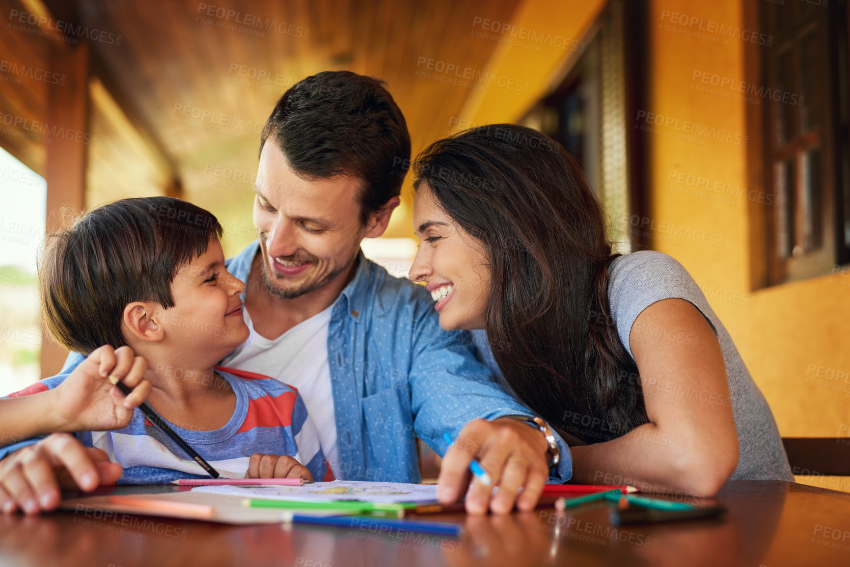 Buy stock photo Drawing, smile and homework with family at table for education, support and school project. Learning, knowledge and lesson development with parents and child at home for academic tutor together