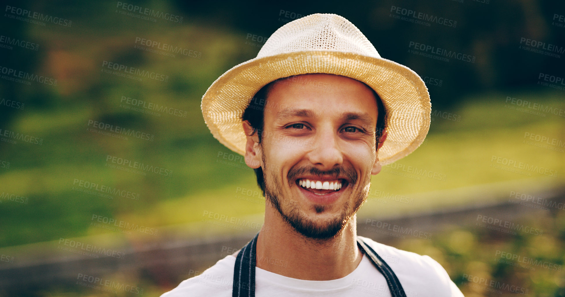 Buy stock photo Portrait of a handsome young man working in a garden