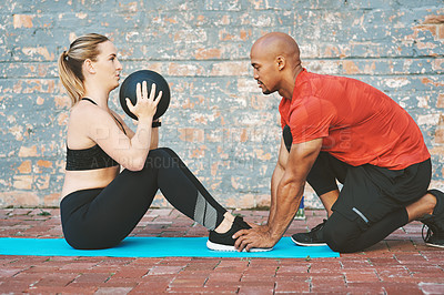 Buy stock photo Ball, fitness and coach with woman for workout, exercise and on yoga mat for sport. Partnership, personal trainer and athlete on break by brick wall at gym for wellness, training or healthy lifestyle