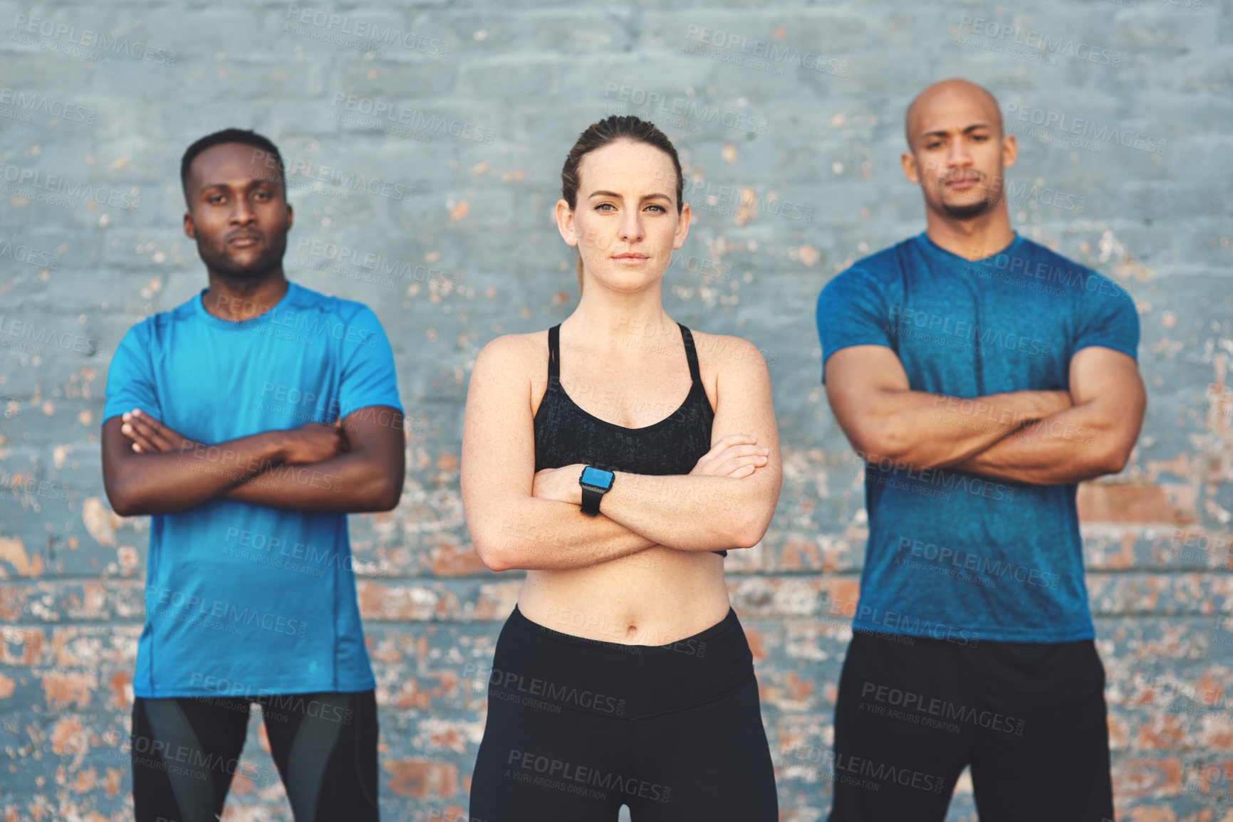 Buy stock photo Portrait, health and woman by brick wall for confidence with diversity, sports and serious team. Fitness, wellness and face of female athlete outdoor with pride for workout, global group and exercise