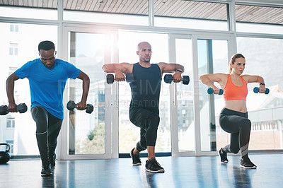 Buy stock photo Shot of people working out in the gym