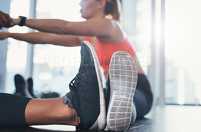 Buy stock photo Stretching, gym shoes and personal trainer with warm up for fitness, workout and training with flexibility exercise. Athlete, woman and above with wellness and progress of leg routine for sport