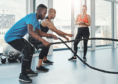Buy stock photo People, men and ropes for fitness in gym for workout, training and resilience for healthy lifestyle. Sports, coach and athletes exercise to target muscle, arms and shoulders with balance for strength