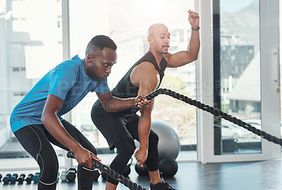 Buy stock photo Shot of people working out in the gym