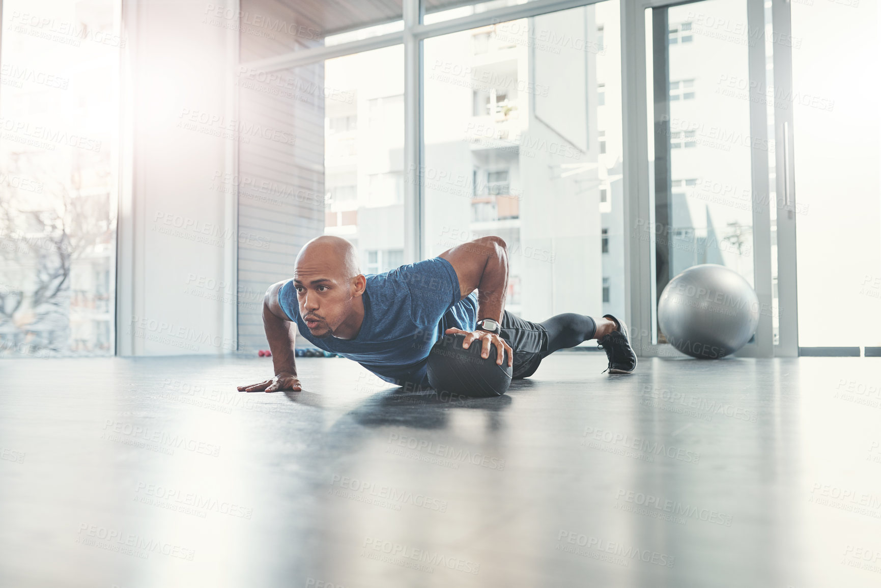 Buy stock photo Man, push up and medicine ball in gym for fitness, health and wellness, athlete and workout. Exercise, strong and bodybuilder in sport centre for body care, performance and endurance training 