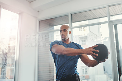 Buy stock photo Workout, man and fitness ball in gym for strength, training and wellness for healthy lifestyle. Sports, black person and exercise for healthcare, resilience and bodybuilder or athlete with commitment