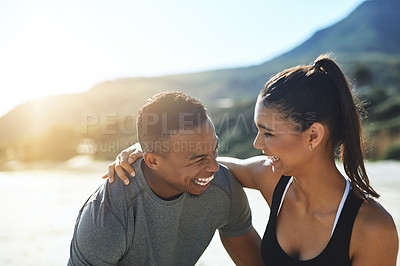 Buy stock photo Hug, running and couple on beach for start of training, fitness or personal trainer. Funny, exercise and marathon cardio with people in nature for happiness, laughing and workout performance together