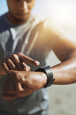 Buy stock photo Training, smart watch and arm of man on beach for start of running, fitness and heart rate tracker. Race, exercise and marathon cardio with runner for wellness app, digital and sport performance