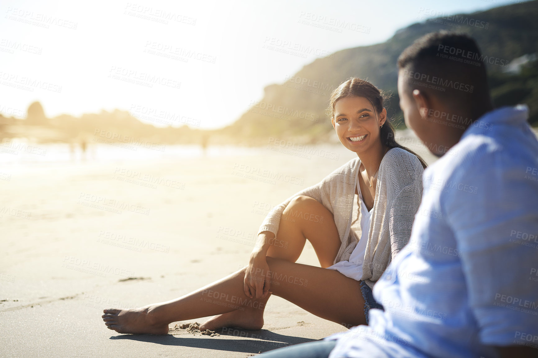 Buy stock photo Couple, relax and talking on beach for travel, bonding and tropical holiday with sunshine, love and support. Man, woman and happy outdoor by ocean for vacation, trip and summer with romantic date