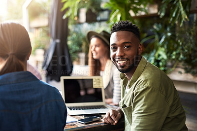 Buy stock photo Portrait of a young designer having a meeting with his colleagues at a coffee shop