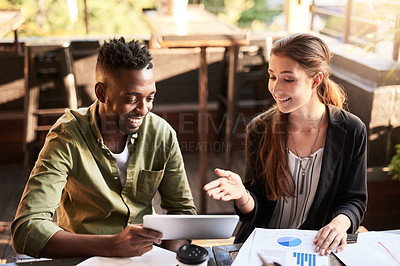 Buy stock photo Shot of two designers having a meeting at a coffee shop