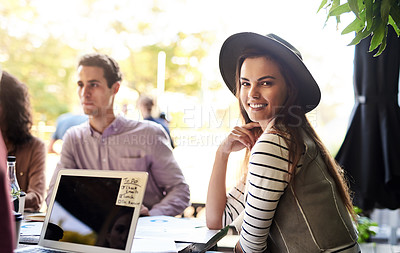 Buy stock photo Portrait of a young designer having a meeting with her colleagues at a coffee shop