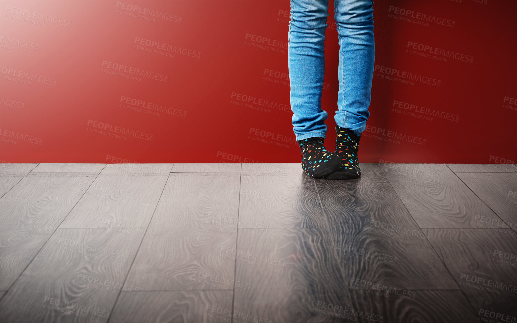 Buy stock photo Cropped studio shot of a woman wearing jeans and socks