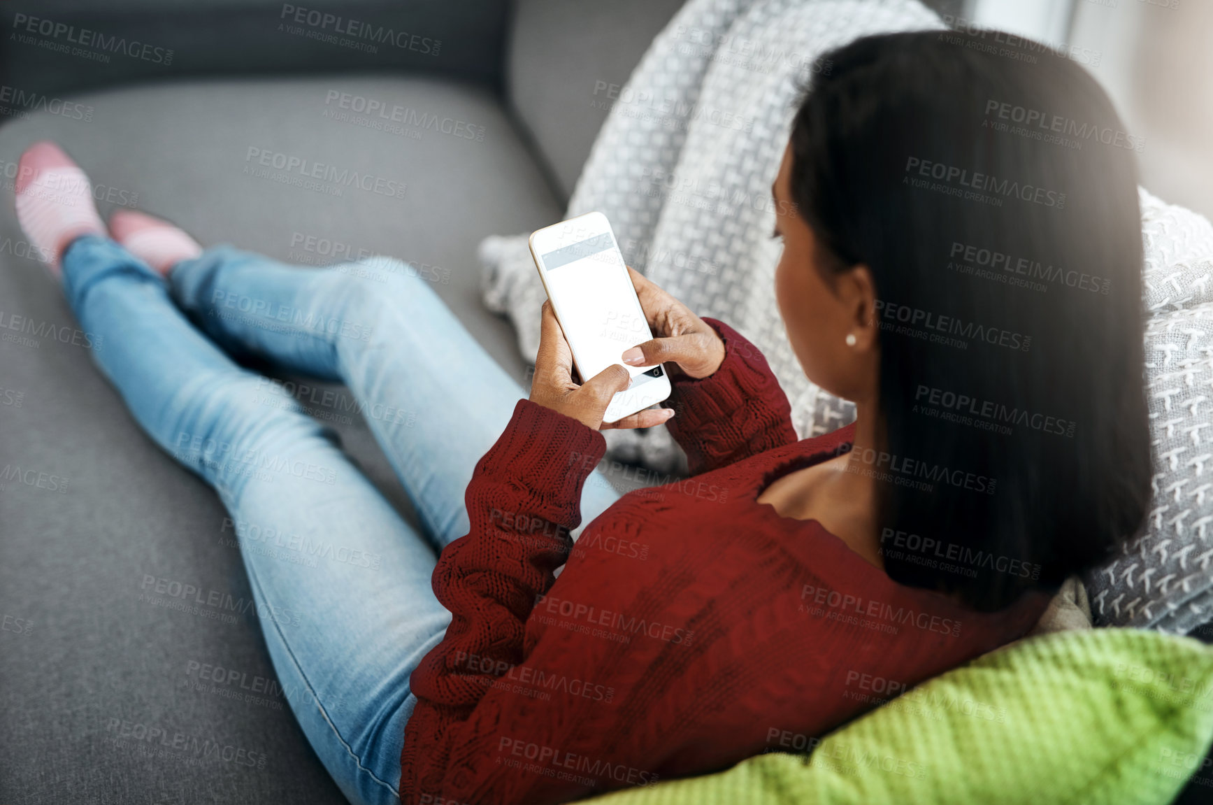 Buy stock photo Top view, home and woman with a smartphone, typing and relax on a couch, connection and communication. Female person, network or girl with a cellphone, social media and search website for information