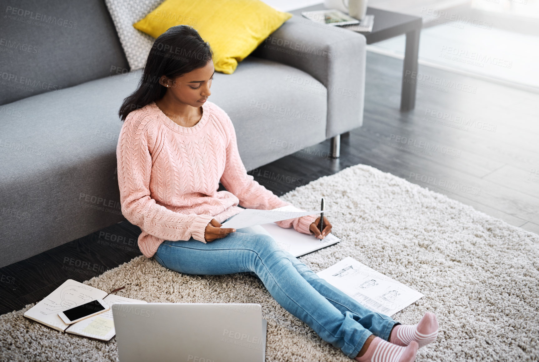 Buy stock photo Female student and notes with laptop and writing on floor in home lounge for learning and studying for education. Young person or scholar with tech and notebook or relax for research in exam test