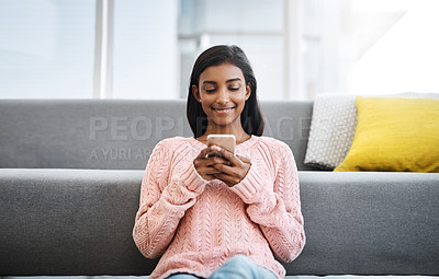 Buy stock photo Relax, floor and Indian woman in lounge with phone for social media, networking or streaming. Happy, scroll and girl in living room on smartphone for communication, online chat or post search in home
