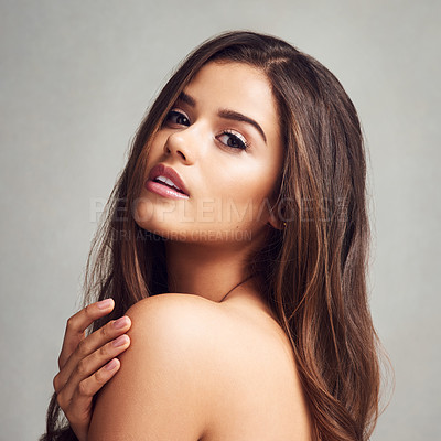 Buy stock photo Woman, portrait and skincare with makeup for haircare, beauty or cosmetics on a gray studio background. Young female person, brunette or attractive model for hair salon, glow or shine on mockup space