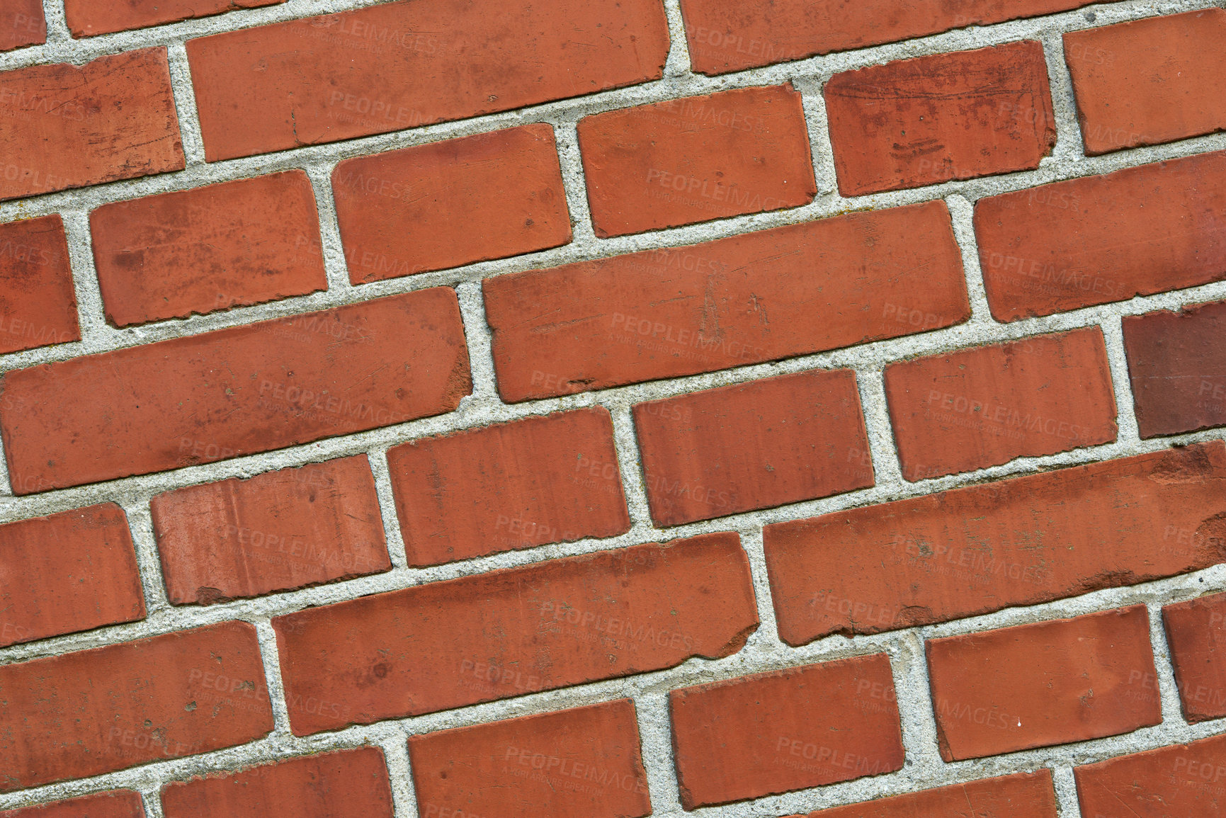 Buy stock photo Closeup of a red brick wall with copy space. Detail of recently built exterior masonry or historic design wall background patterns and textures. Outside zoom of modern industrial style architecture
