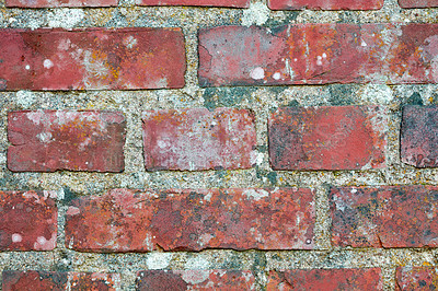 Buy stock photo Closeup of a dirty red brick wall with copy space. Old deteriorating exterior surface of a house. Detail and rough texture of cement blocks concrete layers for construction of a solid structure