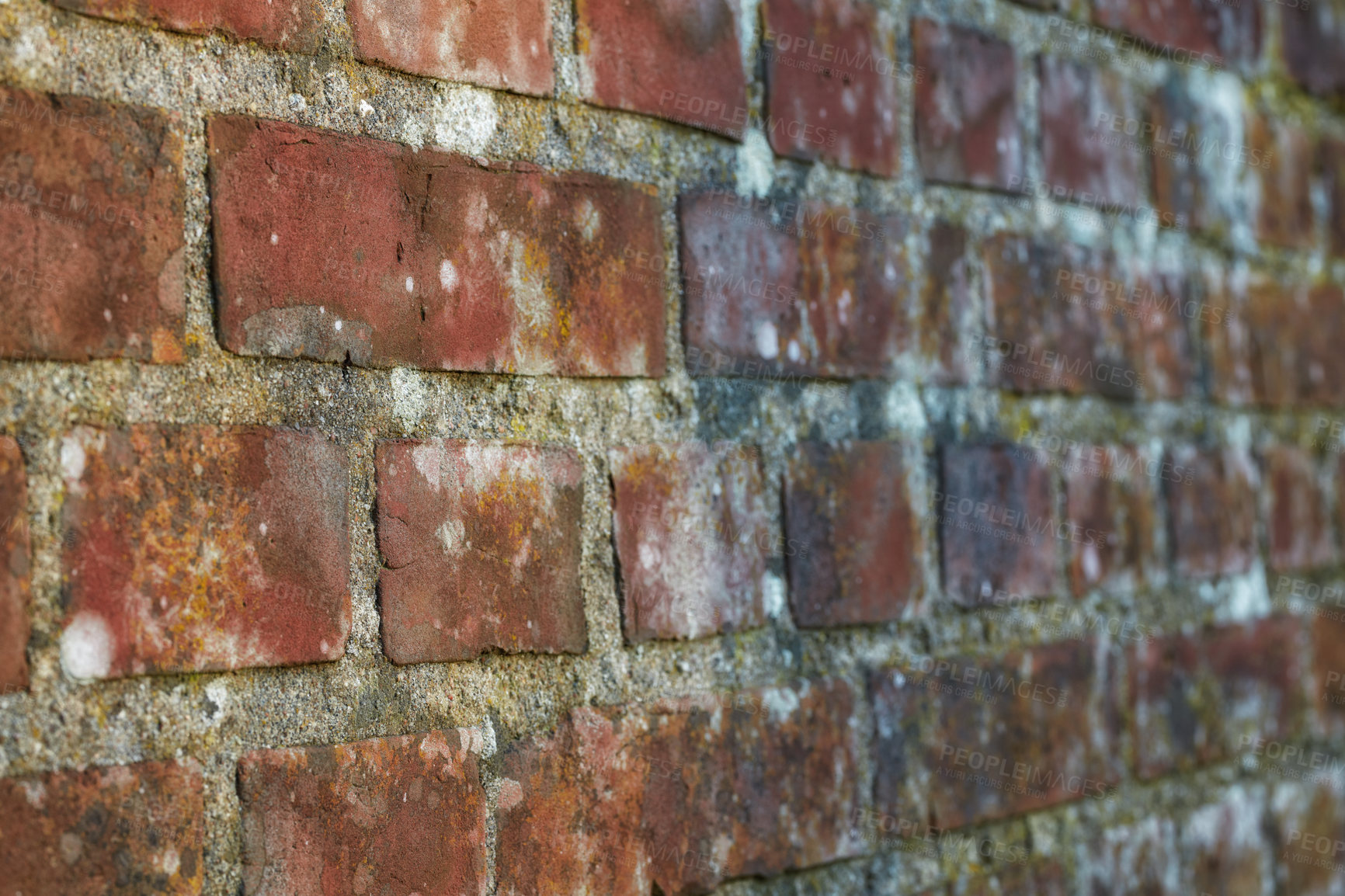 Buy stock photo Closeup of an old red brick wall, copy space on a home exterior, house, or city building. Texture and detail background of strong, solid architecture construction design of a decay moldy structure 