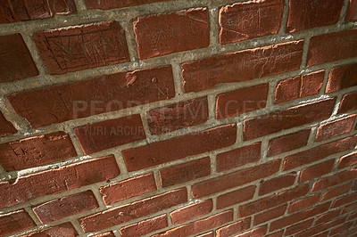 Buy stock photo Above closeup of a wall of red brick still life. Hard solid building material with rough texture on a building in town, city or house. Concrete surface with cement lining to keep a structure intact
