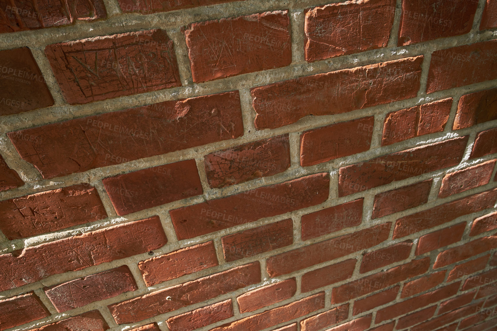 Buy stock photo Above closeup of a wall of red brick still life. Hard solid building material with rough texture on a building in town, city or house. Concrete surface with cement lining to keep a structure intact
