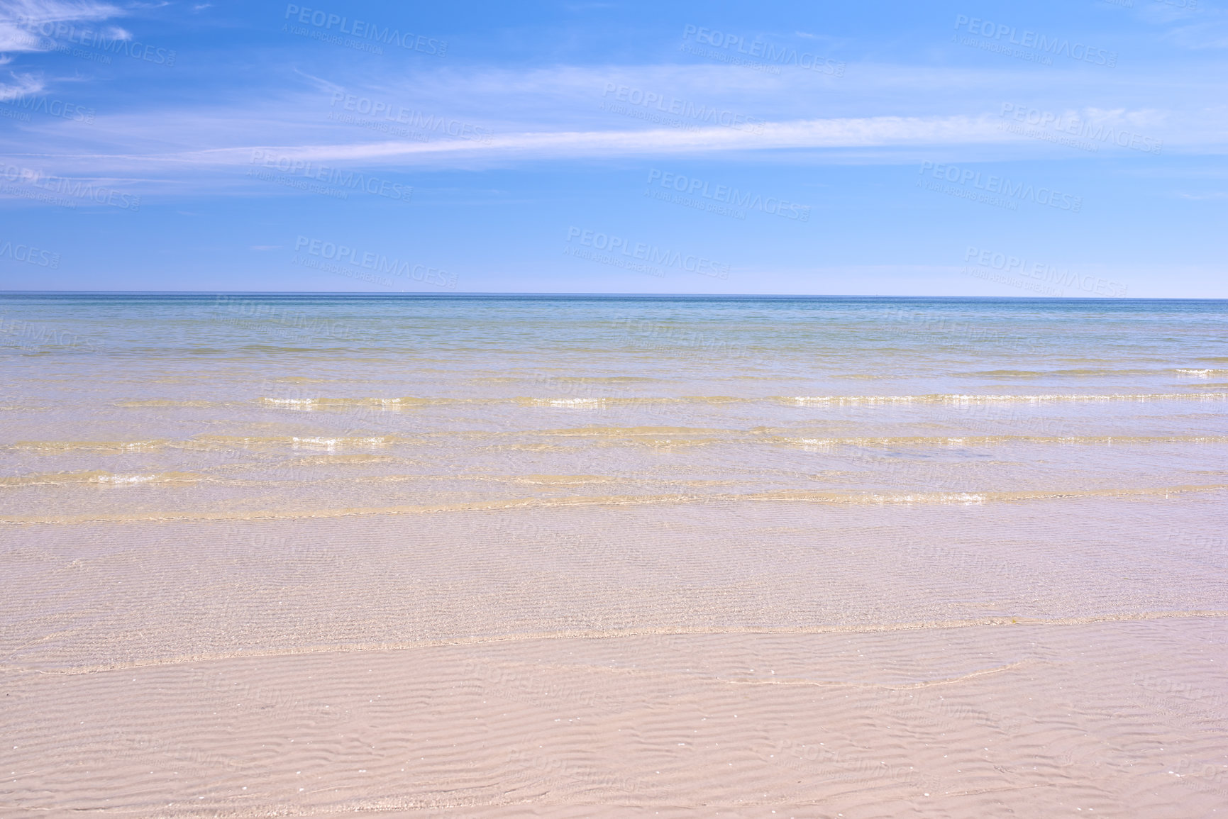 Buy stock photo Copy space at the beach with a blue sky background above the horizon. Calm ocean waves across an empty sea along the shore. Peaceful and tranquil landscape for a relaxing and zen summer getaway 
