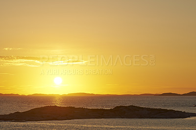 Buy stock photo Seascape copy space with clouds in an orange sunset sky with a copyspace background. Calm, serene, tranquil, peaceful and zen ocean and sea view at dusk. Beautiful scenic mother nature in the evening