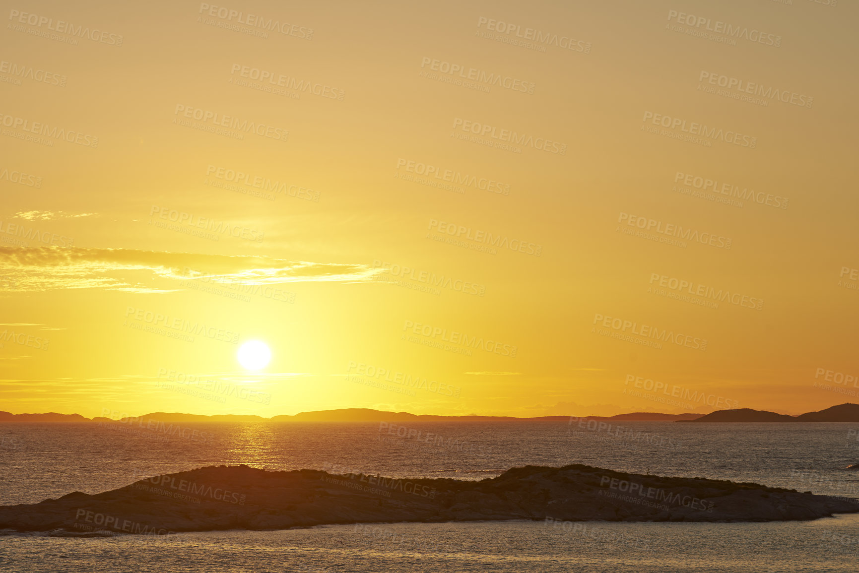 Buy stock photo Seascape copy space with clouds in an orange sunset sky with a copyspace background. Calm, serene, tranquil, peaceful and zen ocean and sea view at dusk. Beautiful scenic mother nature in the evening