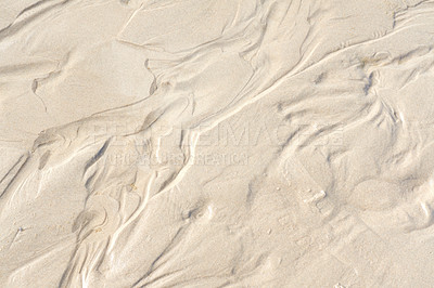 Buy stock photo Abstract white sand sediment pattern, seaside natural organic landscape shining in the sun. Top view of a conceptual textured image of moist sea sand formed at the sea shore on a summer vacation.