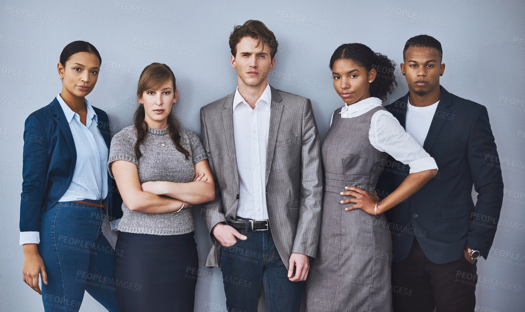 Buy stock photo Cropped portrait of a group of young businesspeople waiting in line for their interviews