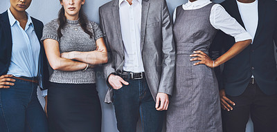 Buy stock photo Cropped shot of a group of unrecognizable businesspeople waiting in line for their interviews