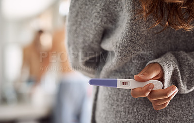 Buy stock photo Closeup, surprise and hands of a woman with a pregnancy test for husband at home. Showing, back and a person holding and hiding a tool with pregnant results during announcement to a man in a house